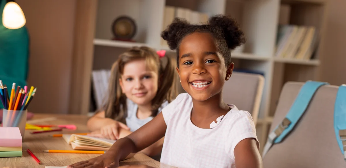 Two girls smiling at the camera