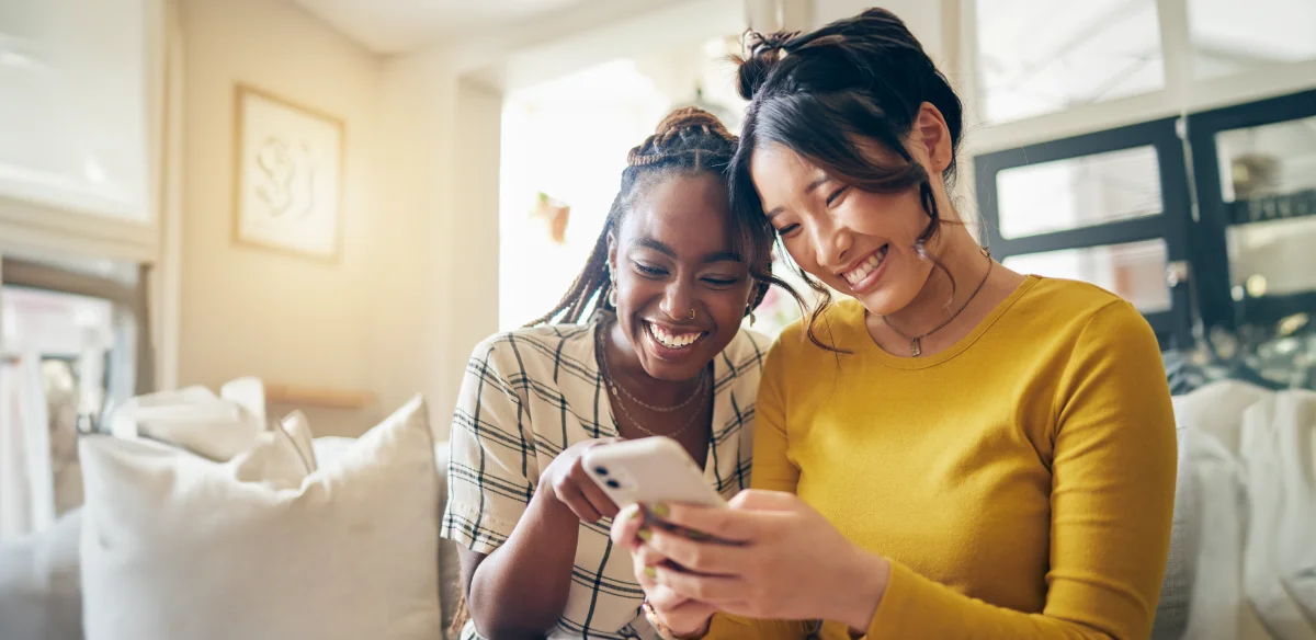 Two girls looing at their cellphone