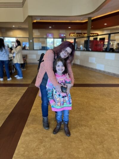 mom hugging her daughter
