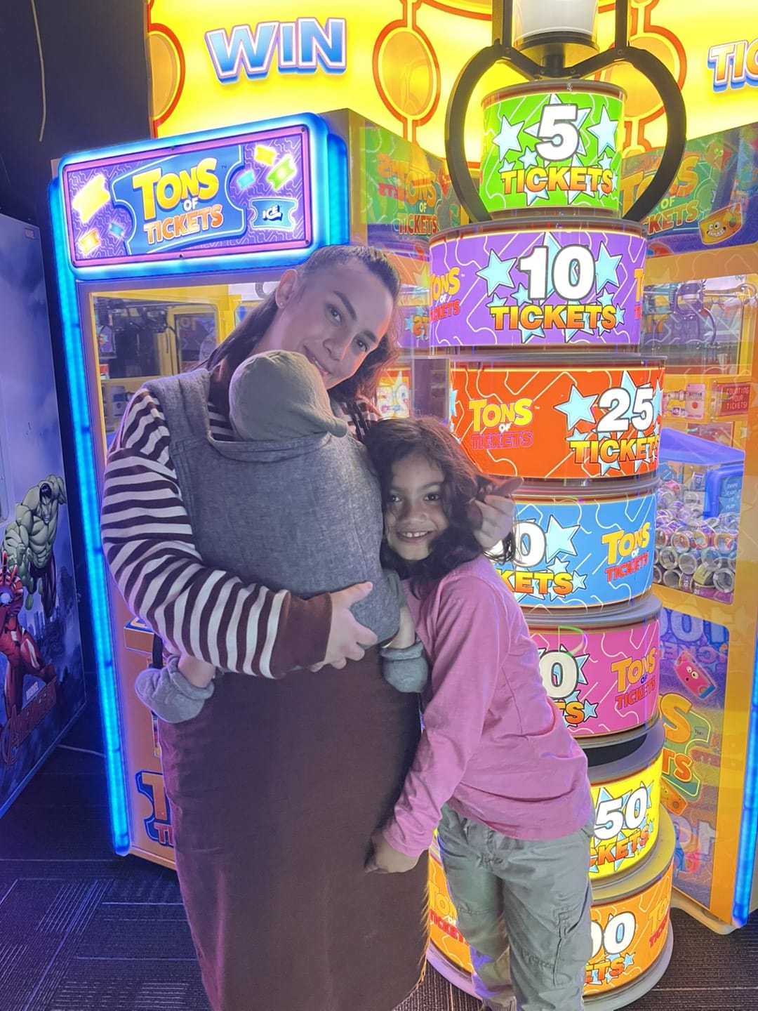 Woman with baby and little girl smiling