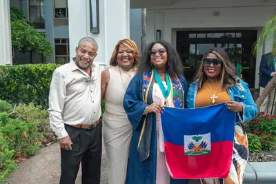 happy family with student at graduation