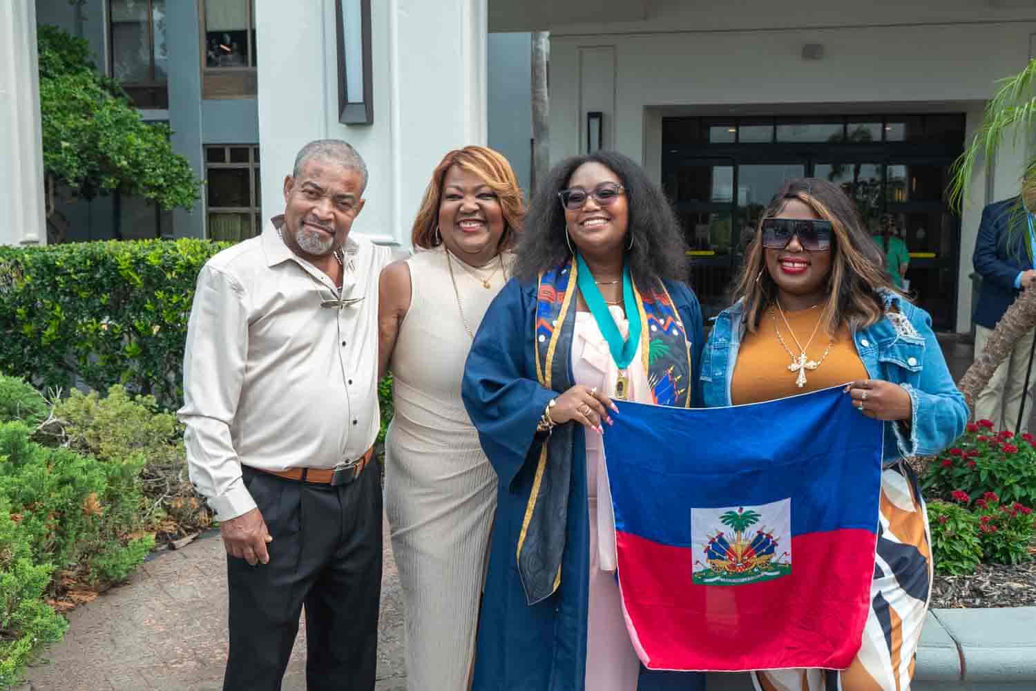 happy family with student at graduation