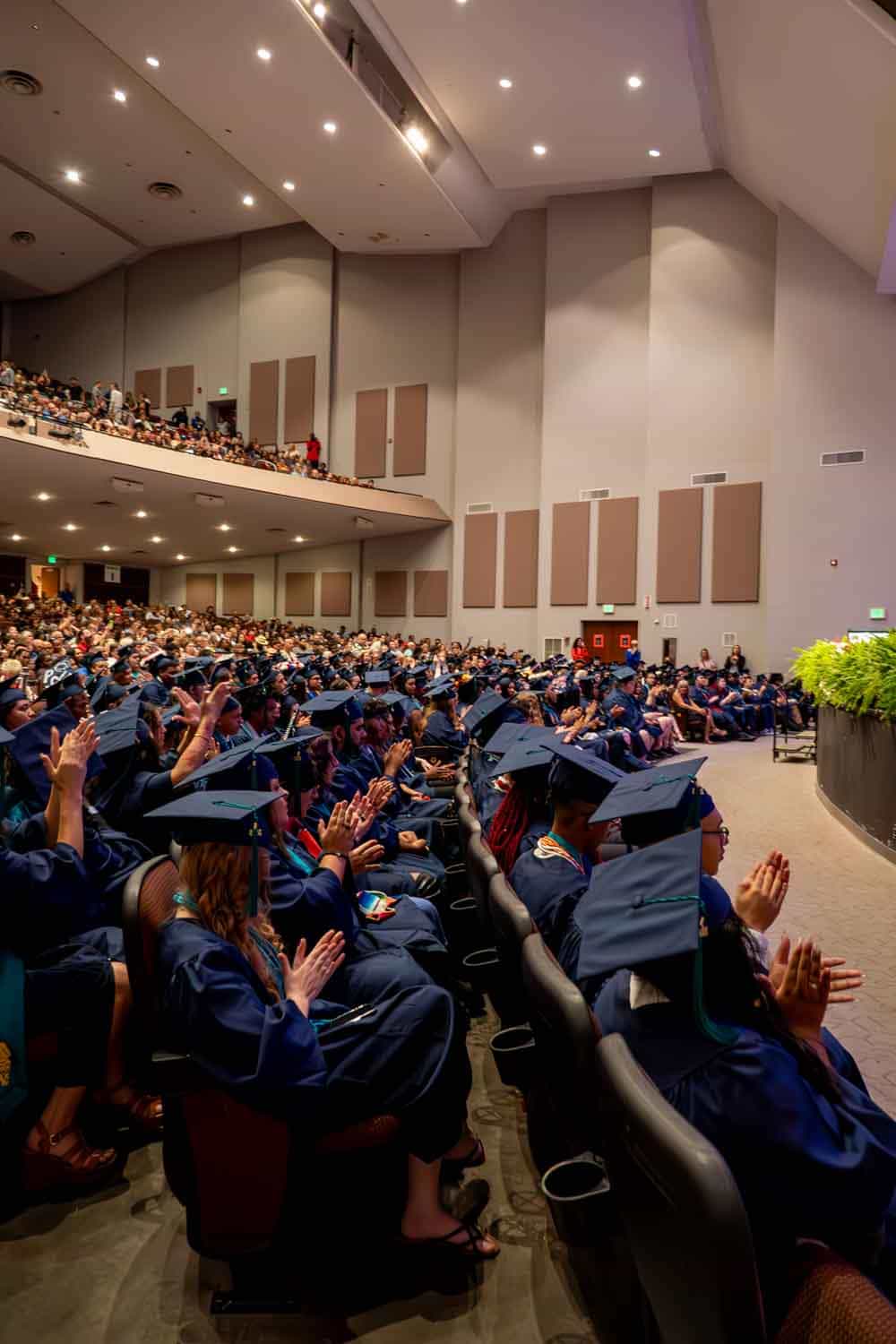 students at the graduation clapping