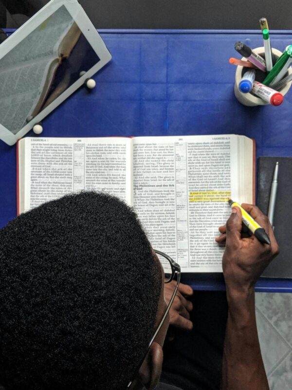 Student reading a bible