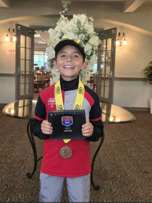 William holding his trophy